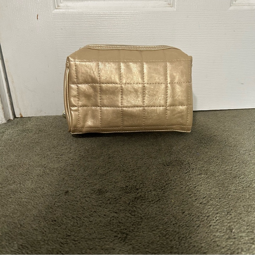 Gold and clear makeup bag set.